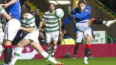 Rangers striker Nikica Jelavic fires over the bar