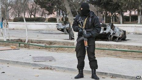 Kazakh riot police officer patrols in centre of Zhanaozen, Kazakhstan (17 Dec 2011)