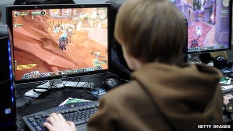 A boy plays World of Warcraft