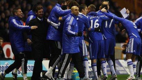 Chelsea players celebrate the opening goal at Wolves with their bench