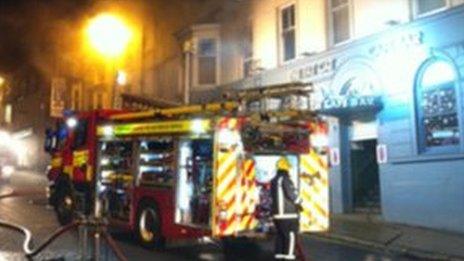 Firefighters outside Fat Cats bar on Bridge Street