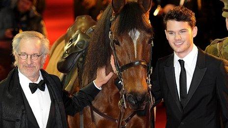 Steven Spielberg (left) with Joey the horse and star Jeremy Irvine