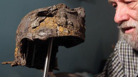 Ken Wallace with the 2,000-year-old Roman cavalry helmet he found