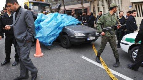 Iranian security forces at the scene of Mostafa Ahmadi-Roshan's killing