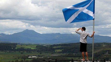 A man looks out over the Carse of Stirling from the base of the Wallace Monument in Stirling. Andrew Milligan/PA Wire