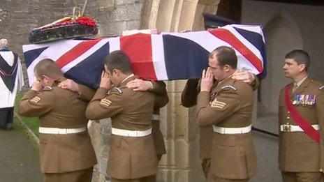 The coffin L/Sgt Dan Collins is carried from the church