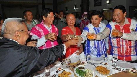 General Mutu Saipo (C), a representative of the rebel Karen National Union (KNU) toasting with Burmese government officials on the eve of peace talks in Hpa-An, the main city of the country's eastern Karen state on January 11, 2012