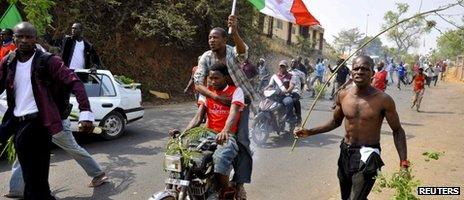 Demonstrators gather during a protest against the elimination of a popular fuel subsidy that has doubled the price of petrol, in Nigeria's capital Abuja, 11 January 2012