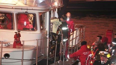 South Korean man is brought ashore after being rescued from Costa Concordia, 15 Jan 2012