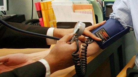 Man having blood pressure taken