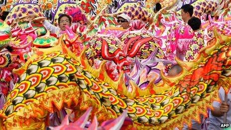 Lion and dragon dancers gather in Hong Kong on 1 January 2012