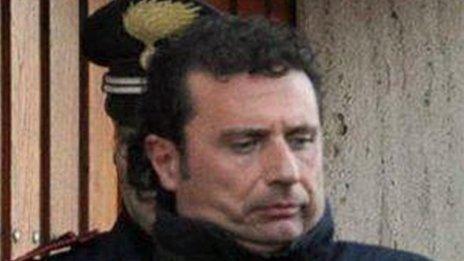 Francesco Schettino, the captain of the luxury cruise ship Costa Concordia enters a police car