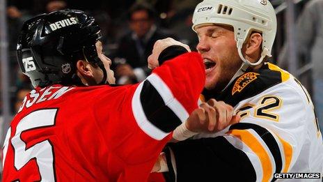 Shawn Thornton of the Boston Bruins and Cam Janssen of the New Jersey Devils fight during an NHL hockey game on January 4, 2012 in Newark, New Jersey