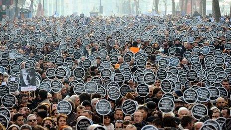 Marchers carry placards reading "We are all Hrant, we are all Armenian" in Istanbul, 19 January