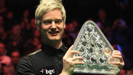 Neil Robertson holds the Masters trophy aloft