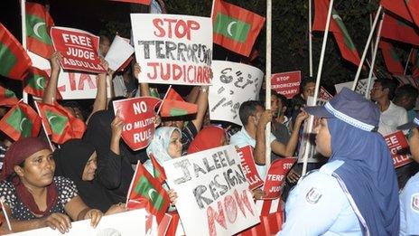 In this handout photograph provided by Haveeru News Service on January 22, 2012, demonstrators gather outside the police and military headquarters in Male on January 21, 2012,