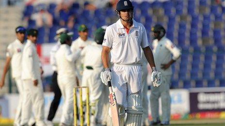 Alastair Cook walks off