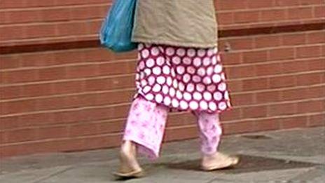 Woman wearing pyjamas outdoors