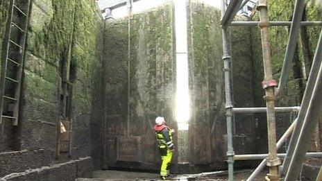 An engineer inside the drained locks