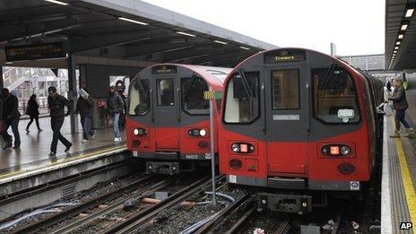 Commuters and Jubilee Line Tube trains at Stratford, east London, 18 January 2012