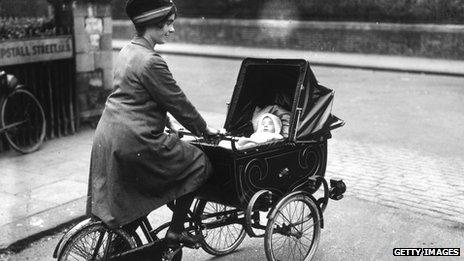 Woman on bicycle pram in 1920s