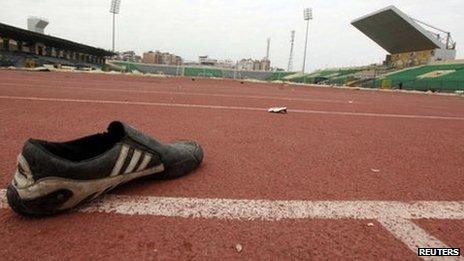 A shoe is seen inside the Port Said stadium one day after soccer supporters clashed February 2, 2012