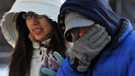 Women walk wrapped up against the cold in Kiev, Ukraine, 2 February