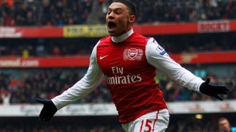 Alex Oxlade-Chamberlain of Arsenal celebrates after he scores Arsenals third goal