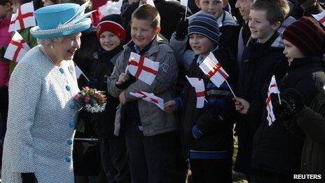 The Queen meeting children waving flags