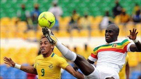 Gabon's Pierre-Emerick Aubameyang challenges for possession in Sunday's quarter-final against Ousmane Berthe of Mali