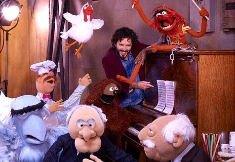 Bret McKenzie (centre) amidst the mayhem of the Muppets