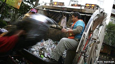 Loading up rubbish in Mexico City