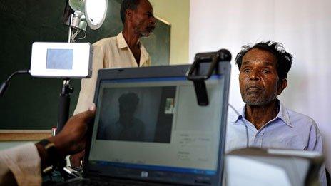 Indian villager has his picture taken for a UID application.