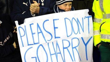 Child holding a sign: Please Don't Go Harry