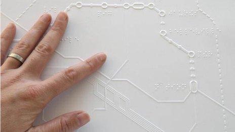 Reading a Braille map of the Paris Metro