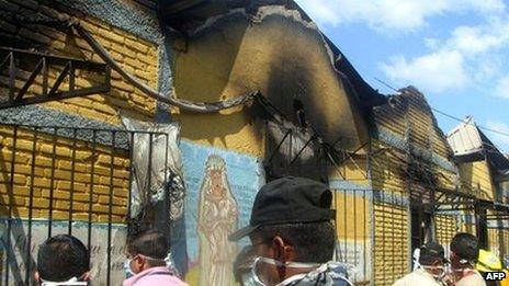 Honduran officials inspect the gutted Comayagua prison. Photo: 15 February 2012