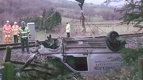 Crane lifts van out of ditch