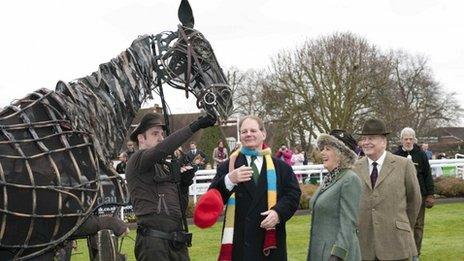 Duchess of Cornwall with a puppet from War Horse at Sandown Park