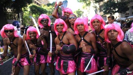 Revellers celebrate carnival at a Rio parade