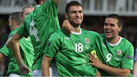 Aaron Hughes with Northern Ireland's record goalscorer David Healy