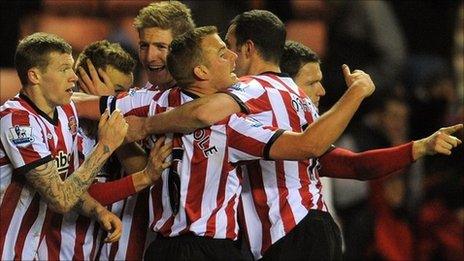 Sunderland celebrate after scoring against Arsenal