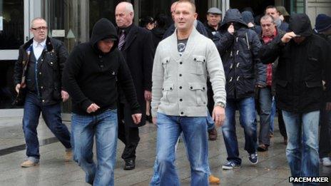 Some of the acquitted men and their supporters emerge from the court after the verdicts