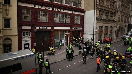 Police and fire officers gather during an emergency services exercise