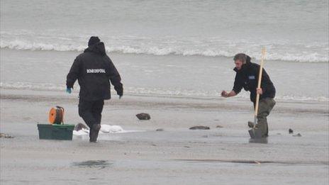 Guernsey Police's bomb disposal team prepare to detonate a World War II anti-tank mine on Pembroke Bay