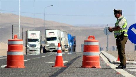 A Chilean policeman guards the closed road to Peru