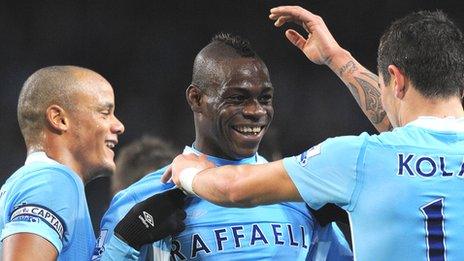 Mario Balotelli (centre) is congratulated by team-mates