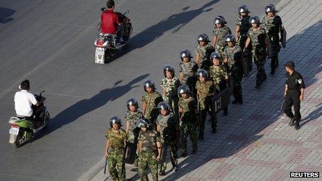 Armed police officers at a square in Kashgar, Xinjiang province (August 2011)