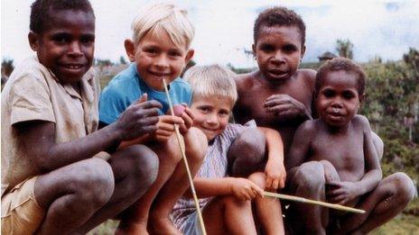 Iain Wilson playing with friends in Papua