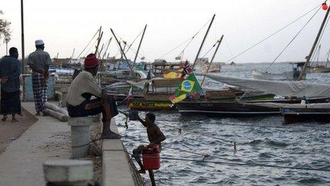 Fisherman seated at a moor in Kenya's resort island of Lamu, 28 February 2012