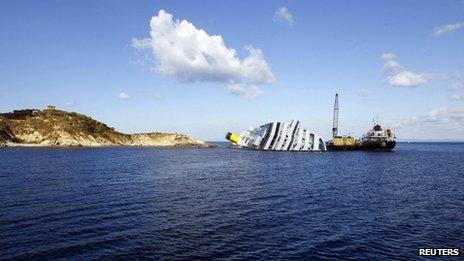 Oil recovery vessels work beside the wreck of the Costa Concordia at Giglio Island, western Italy, 15 February